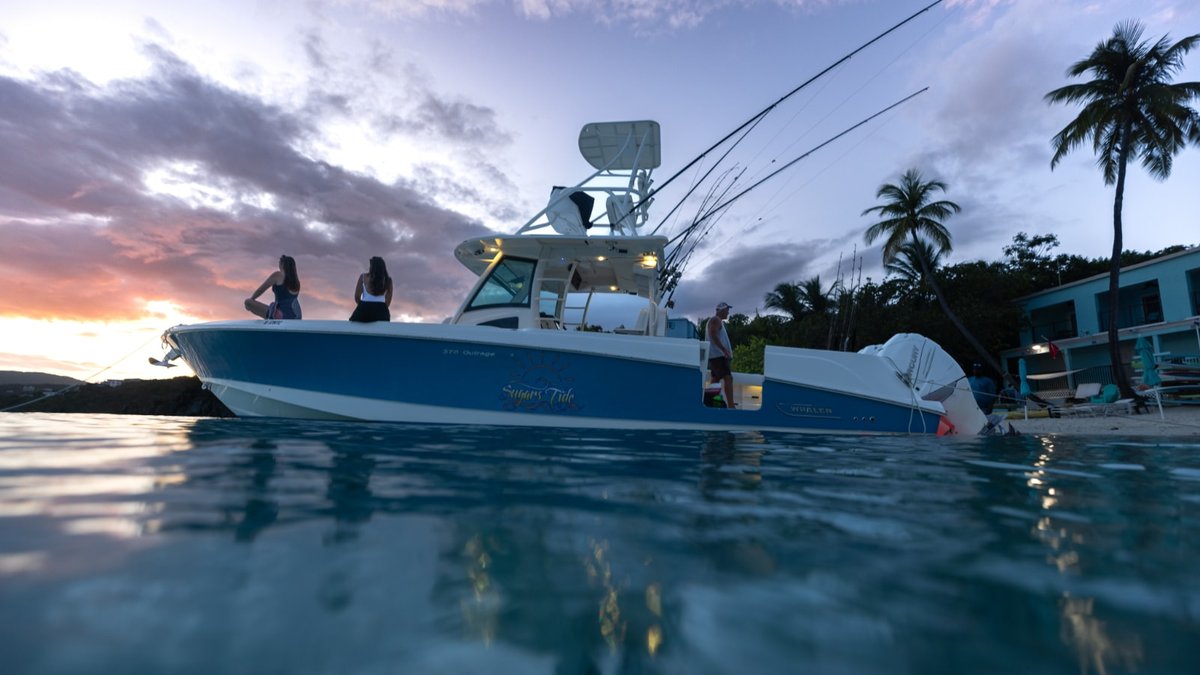 Sugar's Tide, a 37-foot Boston Whaler Outrage, at the beach at dusk, St. Thomas